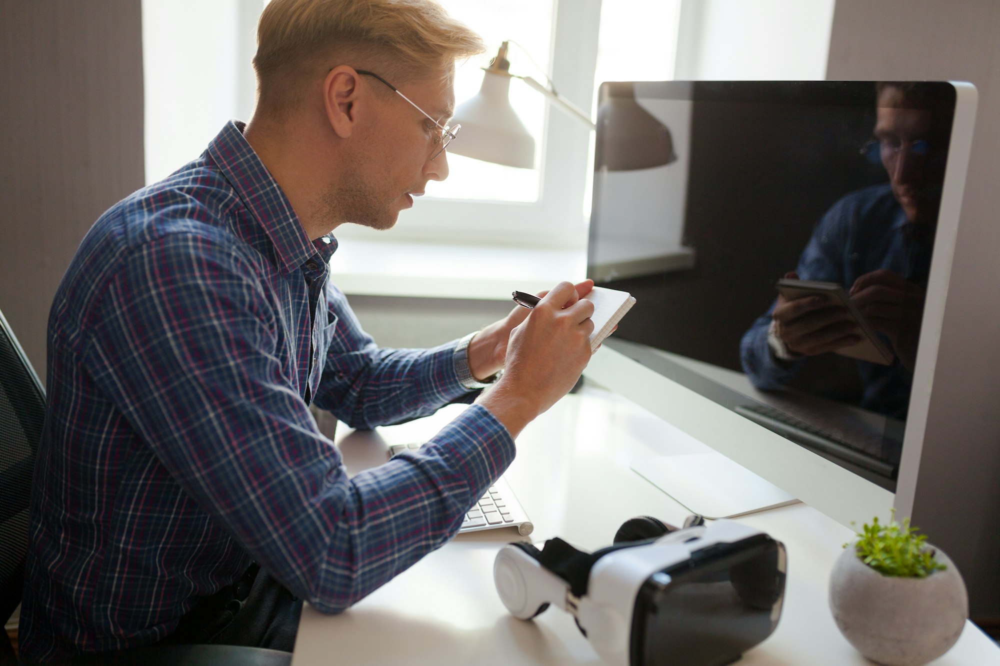 Man in office looking at computer